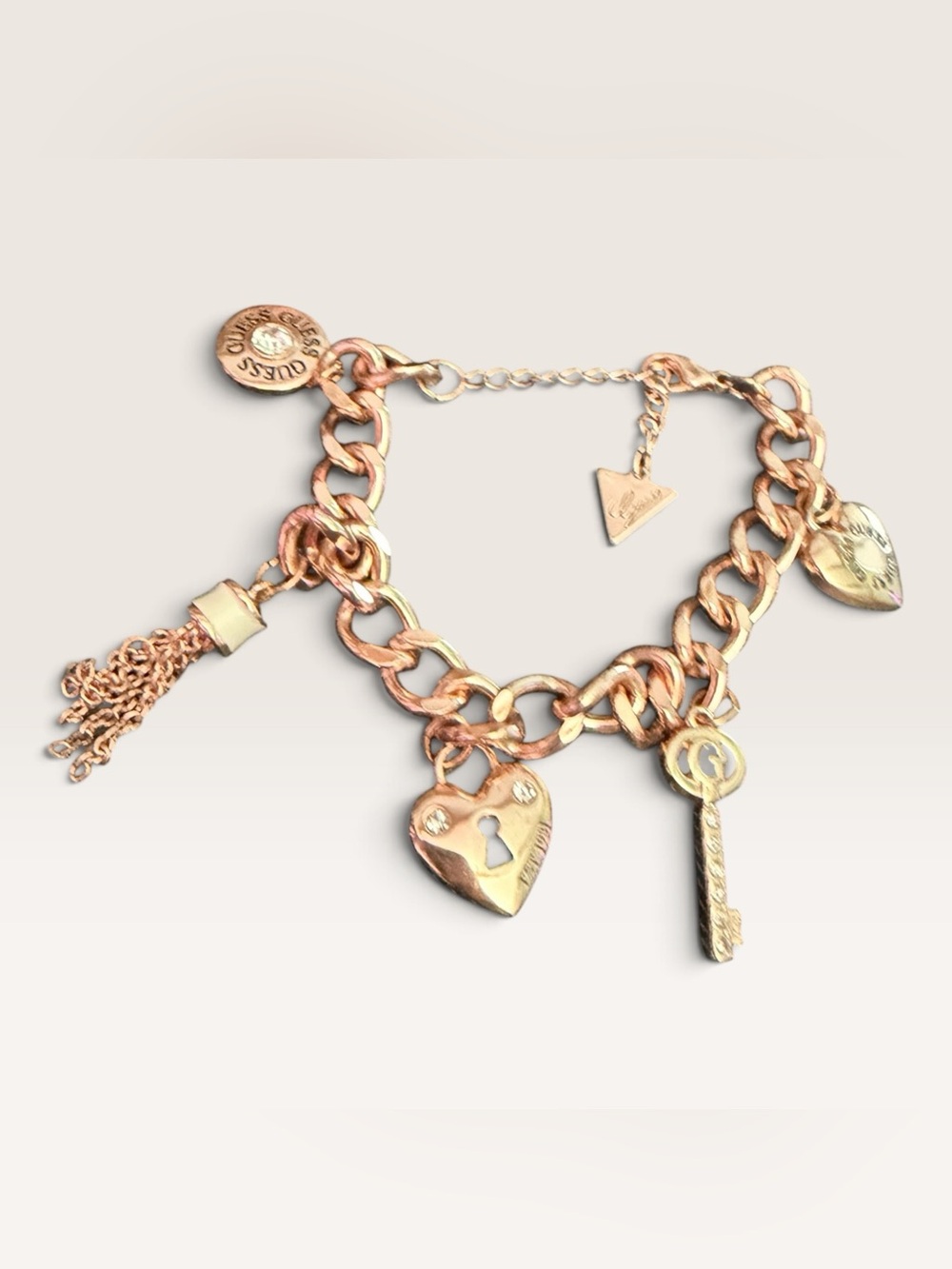 GUESS Rose Gold Tone Charm Bracelet Heart Lock Key Tassel Crystal